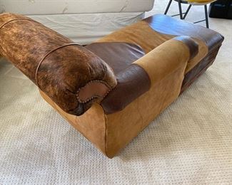 Custom made cowhide & scrolled leather lounge chair	31x67x30	HxWxD	DL4252