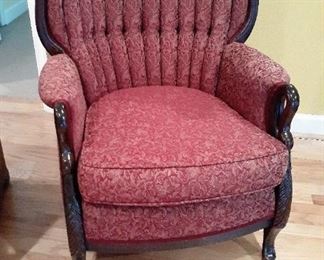 Red tufted antique chair