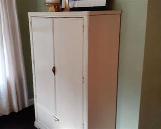 One of the  pieces of furniture in Master Bedroom.  Off white two door armoire with interior drawers