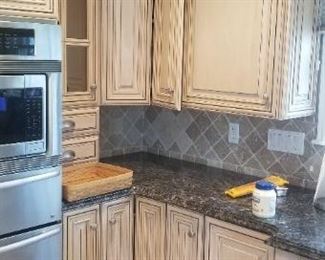 Custom cabinetry, Sub-Zero fridge, Fisher Paykel dishwasher, sink, disposal, matching peninsula with cooktop and all granite $6000 for all. Does not include Thermador oven, warming tray & microwave