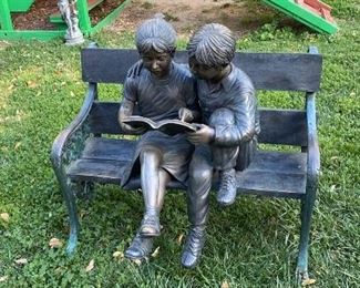 Bronze bench with two kids 