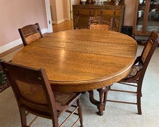 #2	Antique dining table with 4 cane chairs, 3 leaves and pads 48"-78"x48"x28"	 $150.00 
SOLD