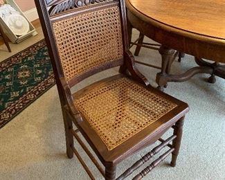#2	Antique dining table with 4 cane chairs, 3 leaves and pads 48"-78"x48"x28"	 $150.00 
SOLD