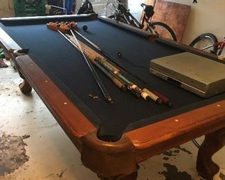 Item #Z26 pool table with pool sticks, balls. $50 must move from the home location.