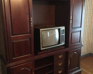 Item #Z38 Kincaid entertainment with slide doors, glass shelves.”, and lighting. $150 must move from the home location.
