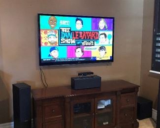 55" LG Smart TV, Polk Audio Monitor speakers, Costco console cabinet