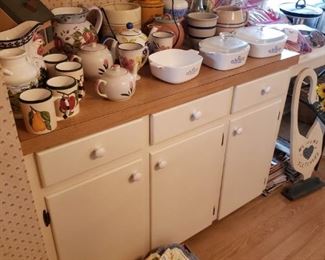 corningware, kitchen towels, pot mitts, etc