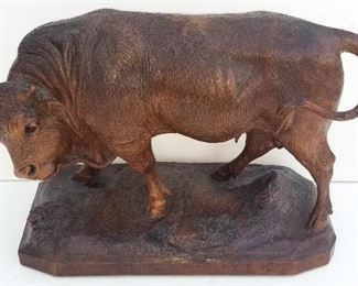 Black Forest Carving 1 of 20 Bull. Carved wood with inset glass eyes. 9.5 x 14 x 6.1 inches. Warm patina. Provenance: This German Austrian Swiss Bavarian Alpine figural carving is one of twenty in the sale from the estate of a New England lifetime collector national business owner retired to central Florida.