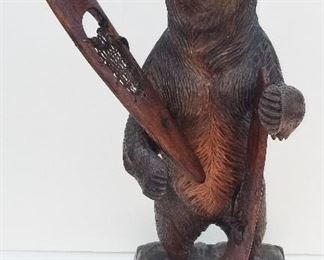 Black Forest Carving 5 of 20 Standing Baer with Snow Shoes. Inset glass eyes. Painted mouth. 18 inches high including soft wood plinth base x 7.5 inches wide x 5.5 inches deep. Provenance: This German Austrian Swiss Bavarian Alpine figural carving is one of twenty in the sale from the estate of a New England lifetime collector national business owner retired to central Florida.