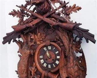 Black Forest Carving 8 of 20, giant deer stag cuckoo clock, brass works, 50 x 30.5 x 19.5 inches. Provenance: This German Austrian Swiss Bavarian Alpine figural carving is one of twenty in the sale from the estate of a New England lifetime collector national business owner retired to central Florida.