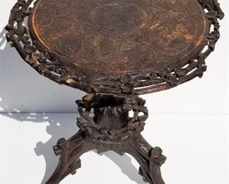 Black Forest Carving 9 of 20, rustic twig tripod candlestand table, 23 inches high with a 21.5 inch diameter top. Provenance: This German Austrian Swiss Bavarian Alpine figural carving is one of twenty in the sale from the estate of a New England lifetime collector national business owner retired to central Florida.