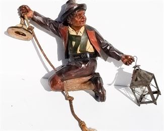 Black Forest Carving 14 of 20, possibly Tyrolean boy swinging on rope full figure chandelier light fixture, 19 Meran 09 carved on the belt, German copyright caved on the reeverse. Provenance: This German Austrian Swiss Bavarian Alpine figural carving is one of twenty in the sale from the estate of a New England lifetime collector national business owner retired to central Florida.