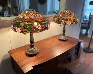 ITEM #47 Pair reproduction Tiffany style 2 way lamps.  The lamp pictured on the left has a few hairline cracks that are hard to notice with the light on or off.  Pictures to follow, $150 pair. 