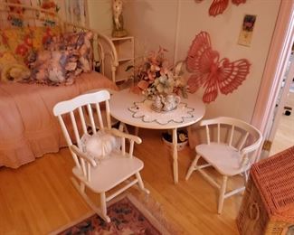 Adorable white table with a chair and a rocker
