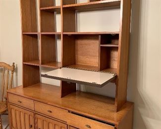 Side phot of cabinet with drop down shelf