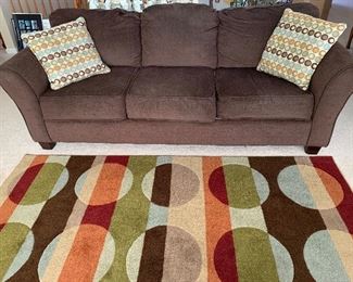 Comfortable sofa w/pillows - area rug also for sale