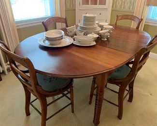 Antique dining table with needlepoint chairs 