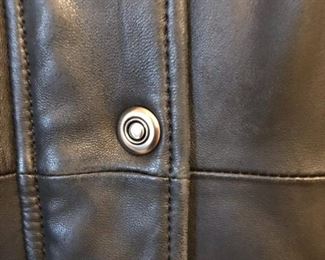 Small amount of wear by buttons and collar