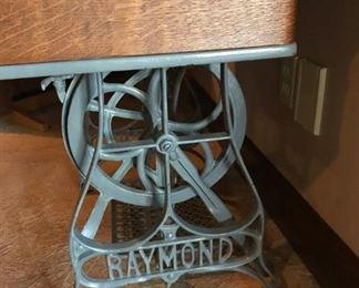 Antique Raymond sewing machine and cabinet with beautiful detail   (machine not in working order)