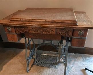 $170.00 - Take 60% off - Antique Raymond sewing machine and cabinet with beautiful detail   (machine not in working order)