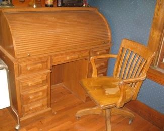 #62-$350. Oak rolltop desk and chair-51"W x 47"H