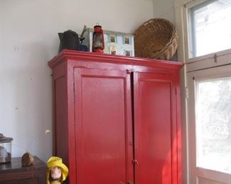 #97-$395. Tall red wardrobe-85-1/2"H x 53"W x 20-1/2"D