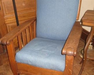 #112-$250. Antique oak push button recliner upholstered in denim