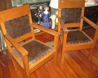 #214-$250.  Pair of oak armchairs-brown "Leather" 