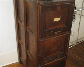 #164-$125. 3 drawer wood file cabinet-one drawer missing trim