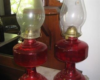 #133-$75. Pair of cranberry oil lamps