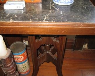 #145-$235. Eastlake table with black marble inset top-31"H x 21" x 21"