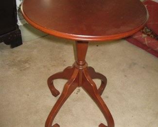 #211-$75. round pedestal table with 4 legs