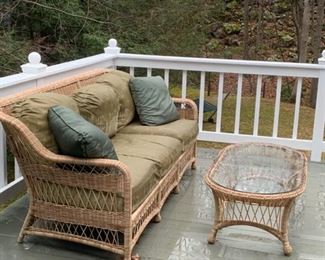 WICKER PATIO SOFA AND TABLE WITH CUSHIONS $400.00. SOLD