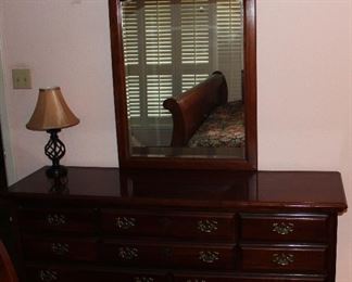 Dixie Cherry 10-Drawer Dresser 34.5”H x 66”W x 19.5”D) with Center Finial Broken Arch Beveled Mirror(47.5”H x 31.5”W)