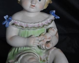 Antique Porcelain Bisque Piano Baby with Doll. Made in Germany (12”H x 10,”D x 8”W)