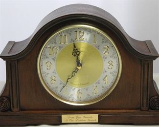 Bulova Chadbourne Tambour Mantel Clock
Bent hardwood Mahogany finish Case. Raised numerals on metal dial w/ Glass Face . Battery Operated Triple chime Engraved plate