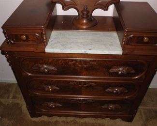 Gorgeous vintage dresser with marble. The side finial is broken off, but it is in a drawer. It measures 65 inches tall and 40 inches wide. There is some slight wear from age. $325.00