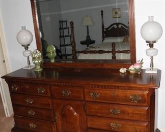 Lovely contemporary dresser with mirror. It is in good condition with minor wear. Dresser measures 34 inches tall by 70 inches long. Mirror measures 50 inches long and 42 inches tall. $225.00