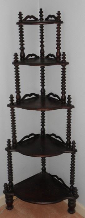 Cute spindle corner shelf. Missing rail on bottom shelf. It measures 56 inches tall. $45.00