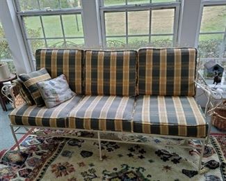 Vintage iron sofa with cushions and side table $125.00