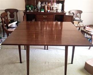 Drop leaf kitchen dining table. Both sides go down with chairs priced separately. Table $175.00 Chairs 6 for $150. Table size 46" wide center add two wings equals total length 6 feet, 