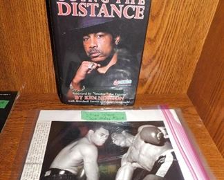 Signed and inscribed Ken Norton book $20.                                 3 authentic vintage Floyd Patterson wire photos $24.