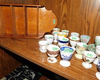 Egg cup collection:  Blue Spode in forefront $14.      Brown Mason in forefront $8.     All others SOLD              Shelf used for egg cup collection $5.