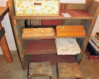Vintage metal cubby $16. Old cabinet shelf with red paint $20.        2 Wooden boxes $1 each.       Tarp $3             2 home made stools $3  