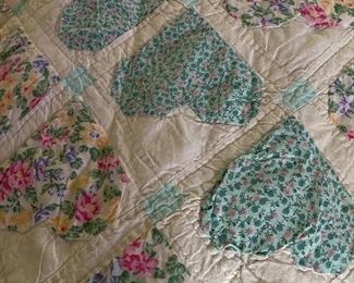 King size quilt with different color hearts including pink, purple etc .. very large and thick .. very nice quilt appears to be hand stitched 
100.00