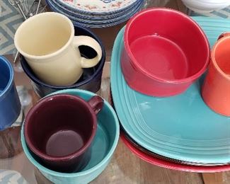 FIESTA WARE  has 4 square plates, 4 bowls, 4 mugs.  Plates 10 each, bowls 8 each, mugs 5 each