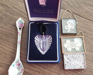 Waterford crystal heart w/black cord $45; painted ceramic tea spoon $10; three small doilies , one is a brooch $5 each