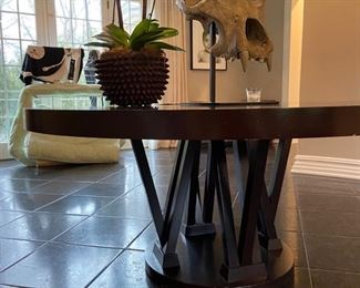 Plantation Designs “Elliot” 72” table 
Intricately interwoven legs give an effective linear look to this modern dining table. $750
