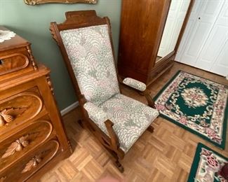 Upholstered platform rocker
Eastlake design
Beautiful carved walnut detail
Excellent condition
$500