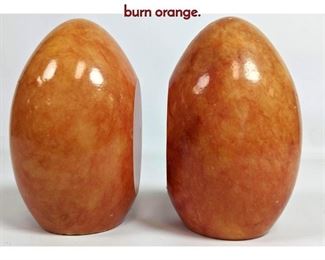Lot 276 Pair Alabaster Egg Form Bookends. Mottled burn orange.